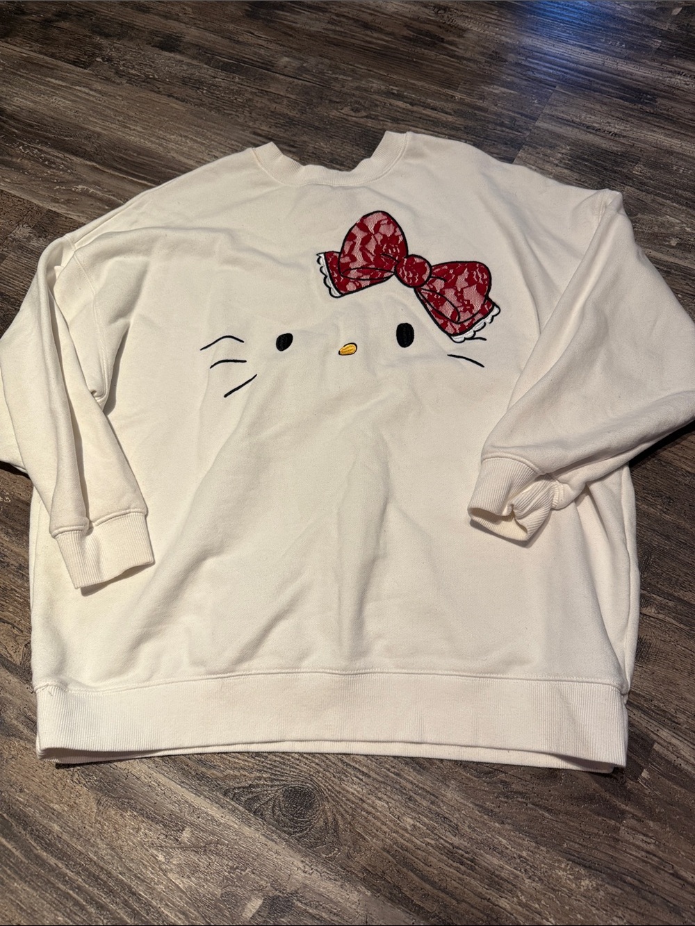 Hello Kitty Cream Crewneck Sweater with Red Lace Bow